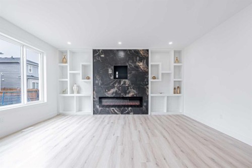 137 Saddlecrest Circle Ne, Calgary, AB - Indoor With Fireplace