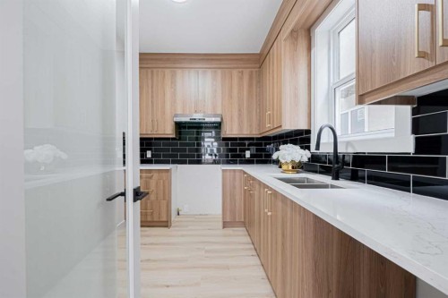 137 Saddlecrest Circle Ne, Calgary, AB - Indoor Photo Showing Kitchen With Double Sink