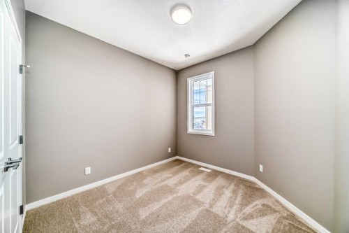 1093 Sawgrass Link Nw, Airdrie, AB - Indoor Photo Showing Other Room