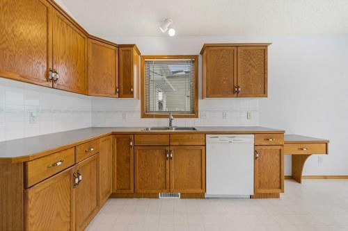 9119 Scurfield Drive Nw, Calgary, AB - Indoor Photo Showing Kitchen With Double Sink