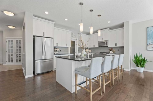 11 Mount Rae Heights, Okotoks, AB - Indoor Photo Showing Kitchen With Stainless Steel Kitchen With Upgraded Kitchen