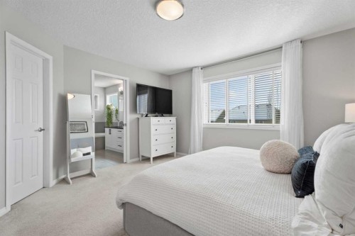 11 Mount Rae Heights, Okotoks, AB - Indoor Photo Showing Bedroom