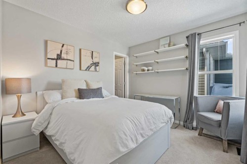 11 Mount Rae Heights, Okotoks, AB - Indoor Photo Showing Bedroom