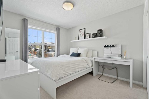 11 Mount Rae Heights, Okotoks, AB - Indoor Photo Showing Bedroom