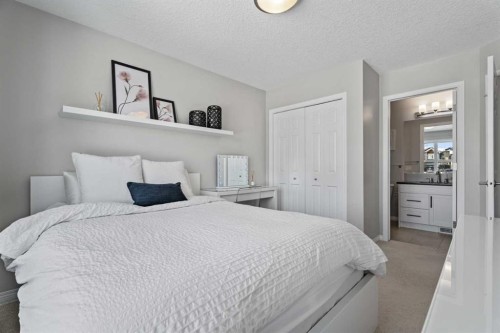 11 Mount Rae Heights, Okotoks, AB - Indoor Photo Showing Bedroom