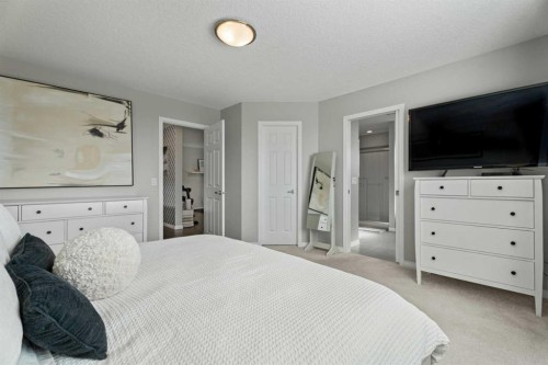 11 Mount Rae Heights, Okotoks, AB - Indoor Photo Showing Bedroom