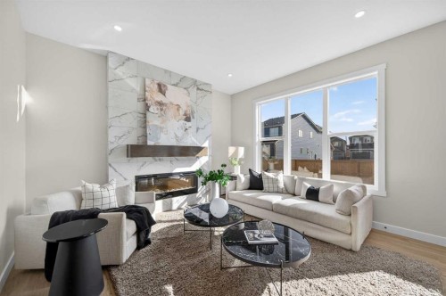 473 Lewiston Landing Ne, Calgary, AB - Indoor Photo Showing Living Room With Fireplace