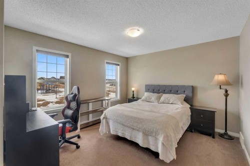 23 Copperpond Square Se, Calgary, AB - Indoor Photo Showing Bedroom