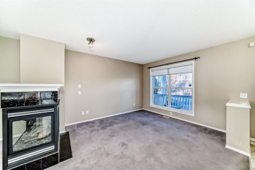 240 Prestwick Way Se, Calgary, AB - Indoor With Fireplace