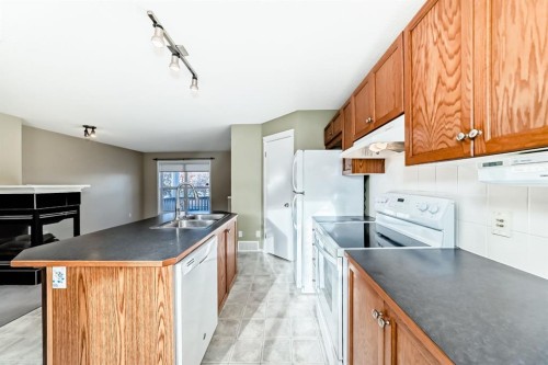 240 Prestwick Way Se, Calgary, AB - Indoor Photo Showing Kitchen With Double Sink