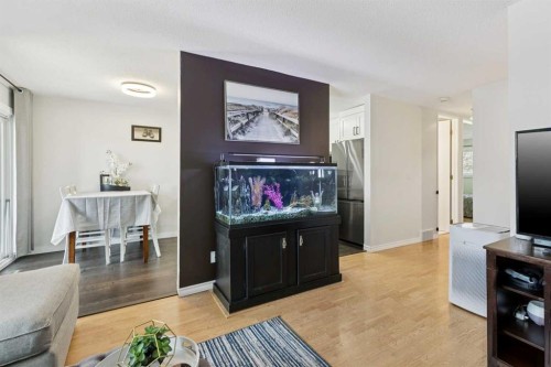 128-6100 4 Avenue Ne, Calgary, AB - Indoor Photo Showing Living Room