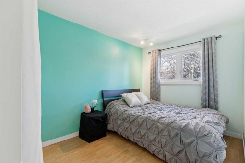 128-6100 4 Avenue Ne, Calgary, AB - Indoor Photo Showing Bedroom