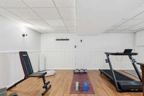 128-6100 4 Avenue Ne, Calgary, AB - Indoor Photo Showing Gym Room