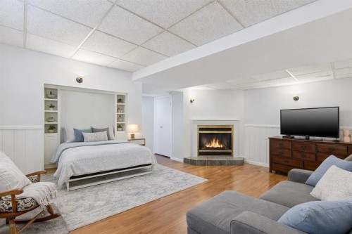 128-6100 4 Avenue Ne, Calgary, AB - Indoor With Fireplace