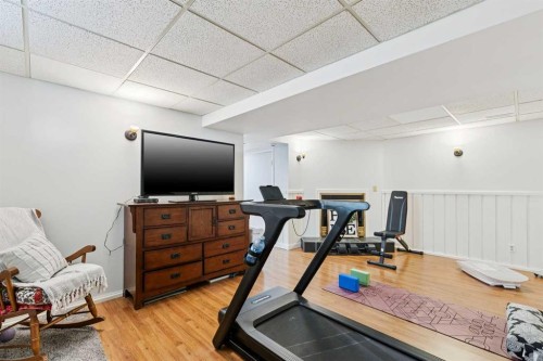 128-6100 4 Avenue Ne, Calgary, AB - Indoor Photo Showing Gym Room