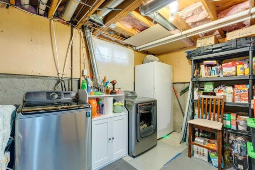 128-6100 4 Avenue Ne, Calgary, AB - Indoor Photo Showing Laundry Room