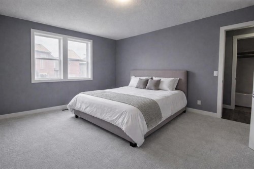 1580 New Brighton Drive Se, Calgary, AB - Indoor Photo Showing Bedroom