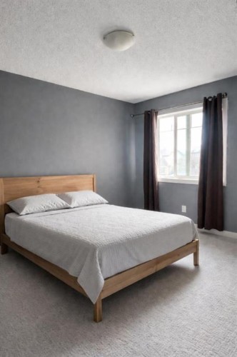 1580 New Brighton Drive Se, Calgary, AB - Indoor Photo Showing Bedroom
