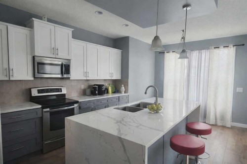 1580 New Brighton Drive Se, Calgary, AB - Indoor Photo Showing Kitchen With Double Sink With Upgraded Kitchen