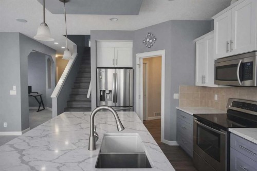 1580 New Brighton Drive Se, Calgary, AB - Indoor Photo Showing Kitchen With Upgraded Kitchen