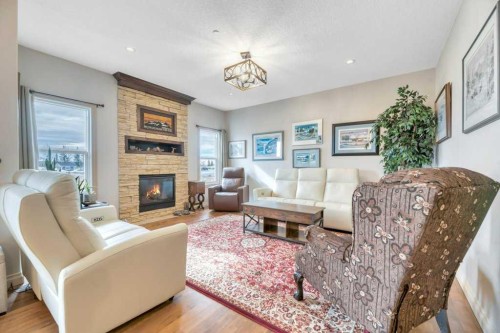 636 Muirfield Crescent, Lyalta, AB - Indoor Photo Showing Living Room With Fireplace