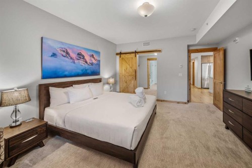 103-905 Spring Creek Drive, Canmore, AB - Indoor Photo Showing Bedroom