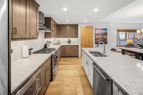 103-905 Spring Creek Drive, Canmore, AB - Indoor Photo Showing Kitchen With Double Sink With Upgraded Kitchen