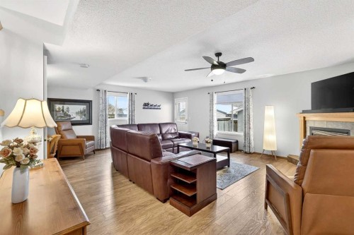131 Citadel Mesa Close Nw, Calgary, AB - Indoor Photo Showing Living Room With Fireplace