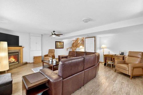 131 Citadel Mesa Close Nw, Calgary, AB - Indoor Photo Showing Living Room With Fireplace