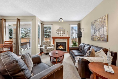 51 Cranleigh Gardens Se, Calgary, AB - Indoor Photo Showing Living Room With Fireplace
