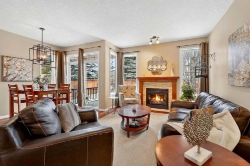 51 Cranleigh Gardens Se, Calgary, AB - Indoor Photo Showing Living Room With Fireplace
