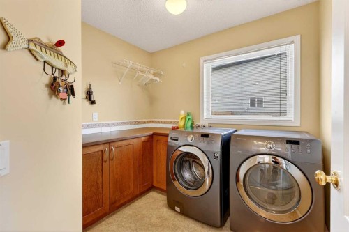 51 Cranleigh Gardens Se, Calgary, AB - Indoor Photo Showing Laundry Room