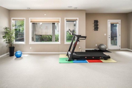 105 Aspen Stone Road Sw, Calgary, AB - Indoor Photo Showing Gym Room