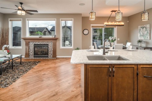 105 Aspen Stone Road Sw, Calgary, AB - Indoor With Fireplace