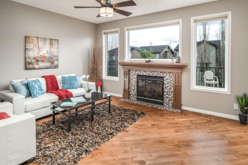 105 Aspen Stone Road Sw, Calgary, AB - Indoor Photo Showing Living Room With Fireplace