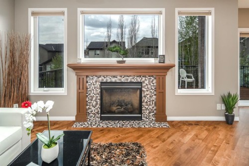 105 Aspen Stone Road Sw, Calgary, AB - Indoor Photo Showing Living Room With Fireplace