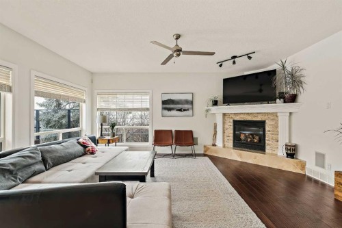 1560 Strathcona Drive Sw, Calgary, AB - Indoor Photo Showing Living Room With Fireplace