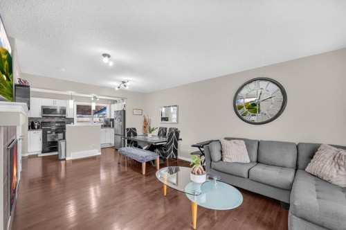 207 Elgin Meadows Gardens Se, Calgary, AB - Indoor Photo Showing Living Room