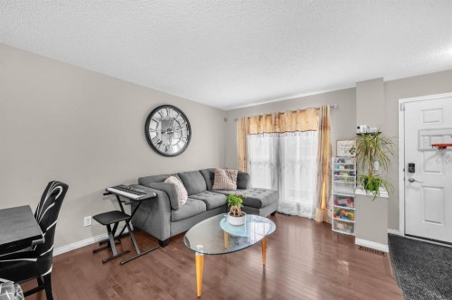 207 Elgin Meadows Gardens Se, Calgary, AB - Indoor Photo Showing Living Room