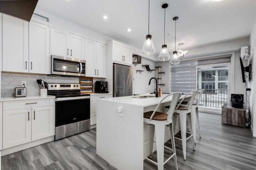 102-500 Auburn Meadows Common Se, Calgary, AB - Indoor Photo Showing Kitchen With Stainless Steel Kitchen With Upgraded Kitchen