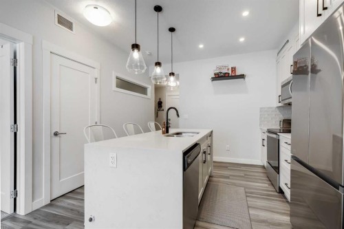 102-500 Auburn Meadows Common Se, Calgary, AB - Indoor Photo Showing Kitchen With Upgraded Kitchen