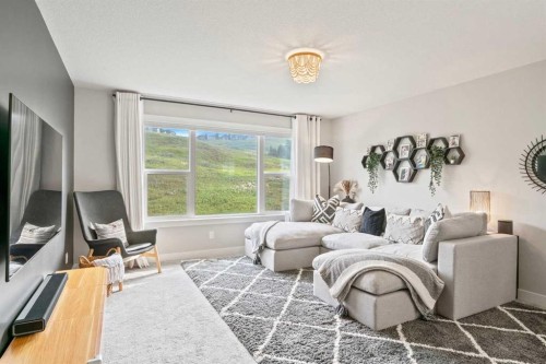 36 Cranbrook Cape Se, Calgary, AB - Indoor Photo Showing Living Room