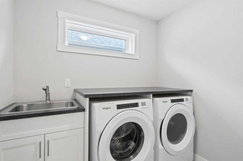36 Cranbrook Cape Se, Calgary, AB - Indoor Photo Showing Laundry Room