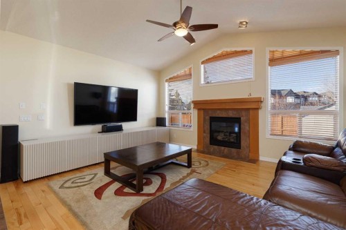 116 Rainbow Falls Grove, Chestermere, AB - Indoor Photo Showing Living Room With Fireplace