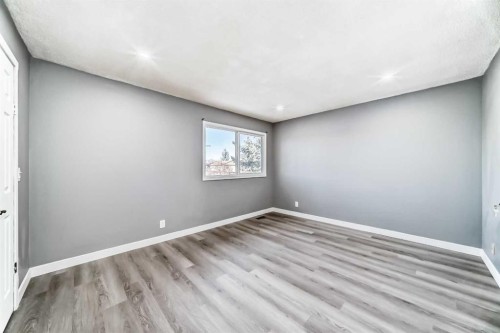 65-6100 4 Avenue Ne, Calgary, AB - Indoor Photo Showing Other Room