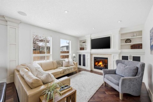 23 Deermoss Place Se, Calgary, AB - Indoor Photo Showing Living Room With Fireplace