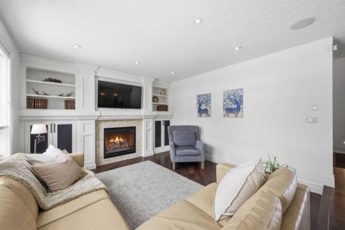 23 Deermoss Place Se, Calgary, AB - Indoor Photo Showing Living Room With Fireplace
