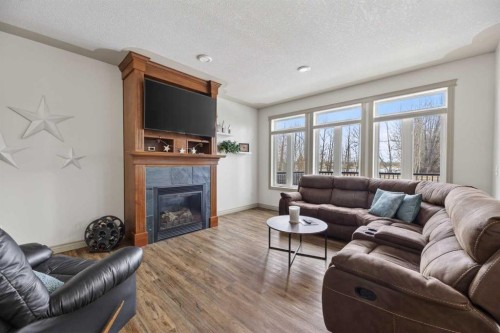 5910 Park Meadows Crescent, Olds, AB - Indoor Photo Showing Living Room With Fireplace