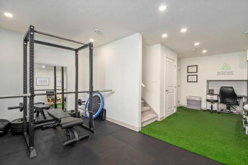 15 Masters Square Se, Calgary, AB - Indoor Photo Showing Gym Room