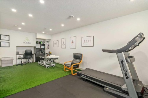 15 Masters Square Se, Calgary, AB - Indoor Photo Showing Gym Room